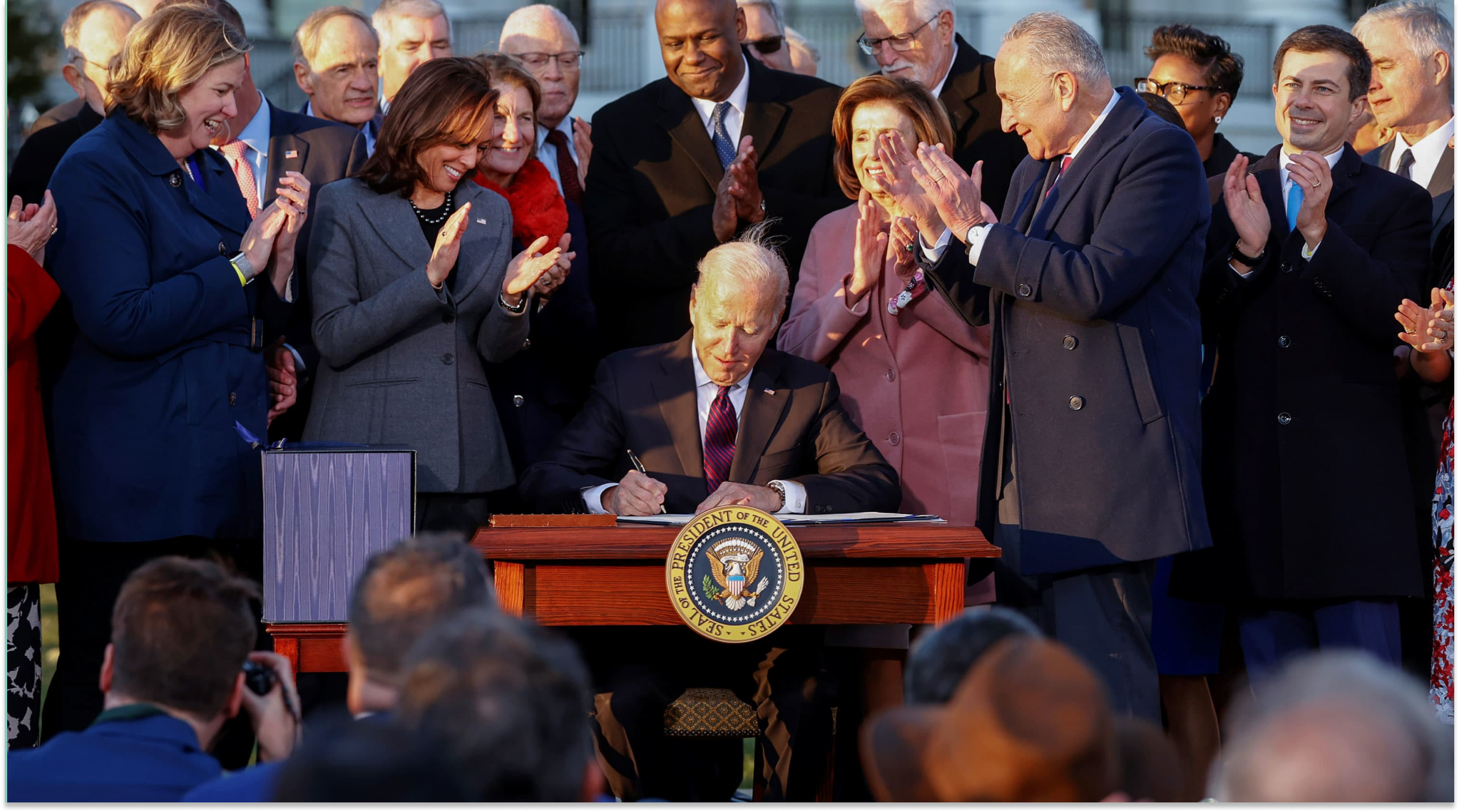 Image of President Biden signing new infrastructure bill into law.