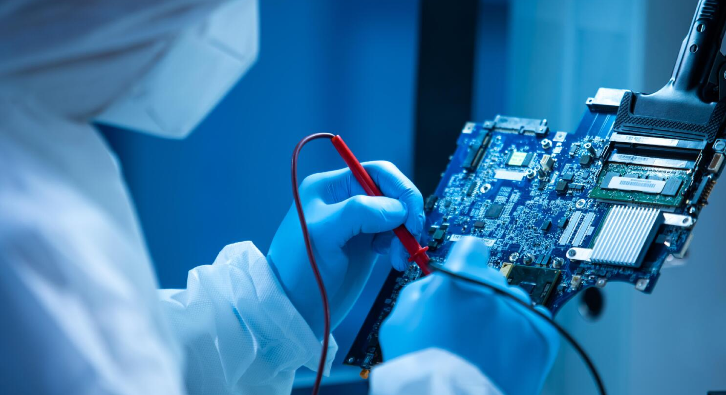 Image of microelectronics worker at work. 