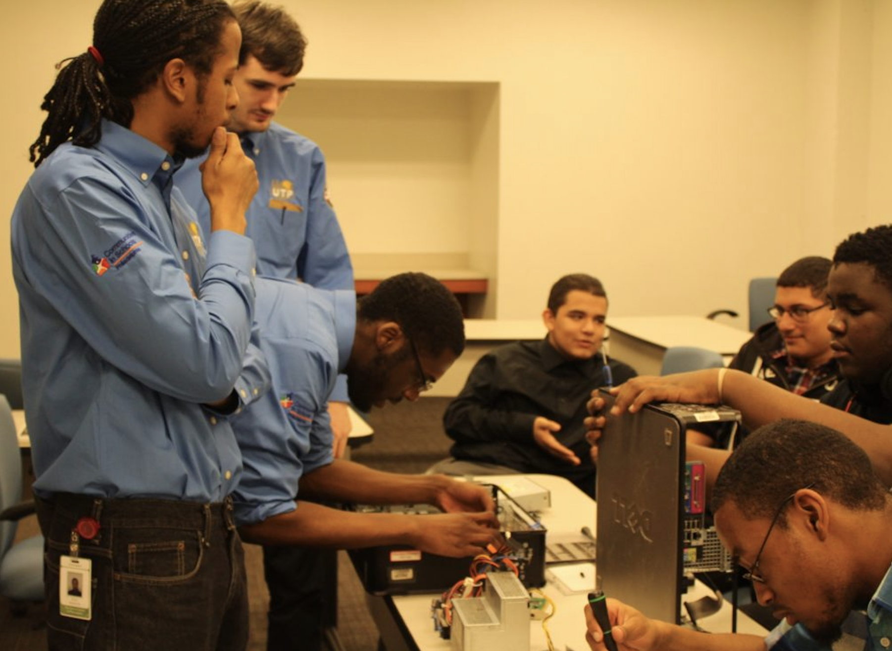 Image of instructors working with apprentices. 
