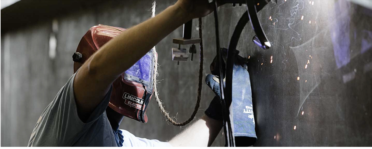 Image of apprentice working with steel.